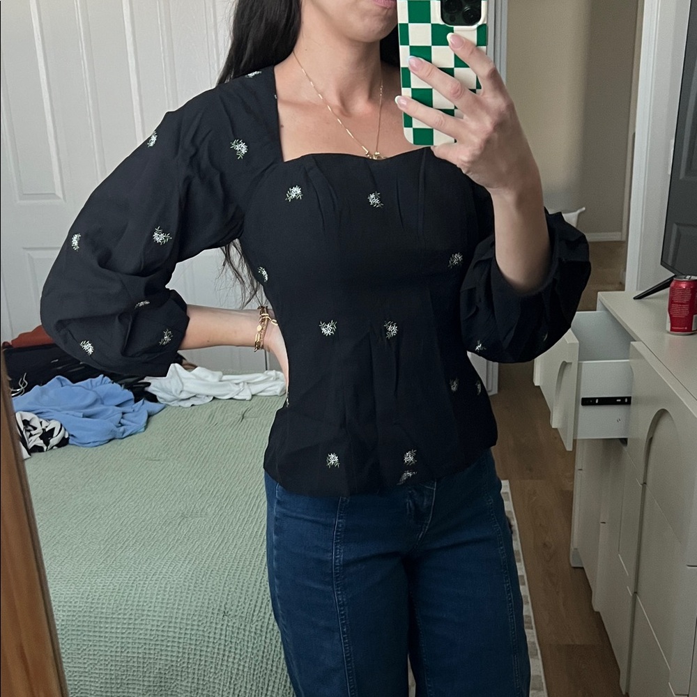 Elegant Black Blouse with Floral Accents